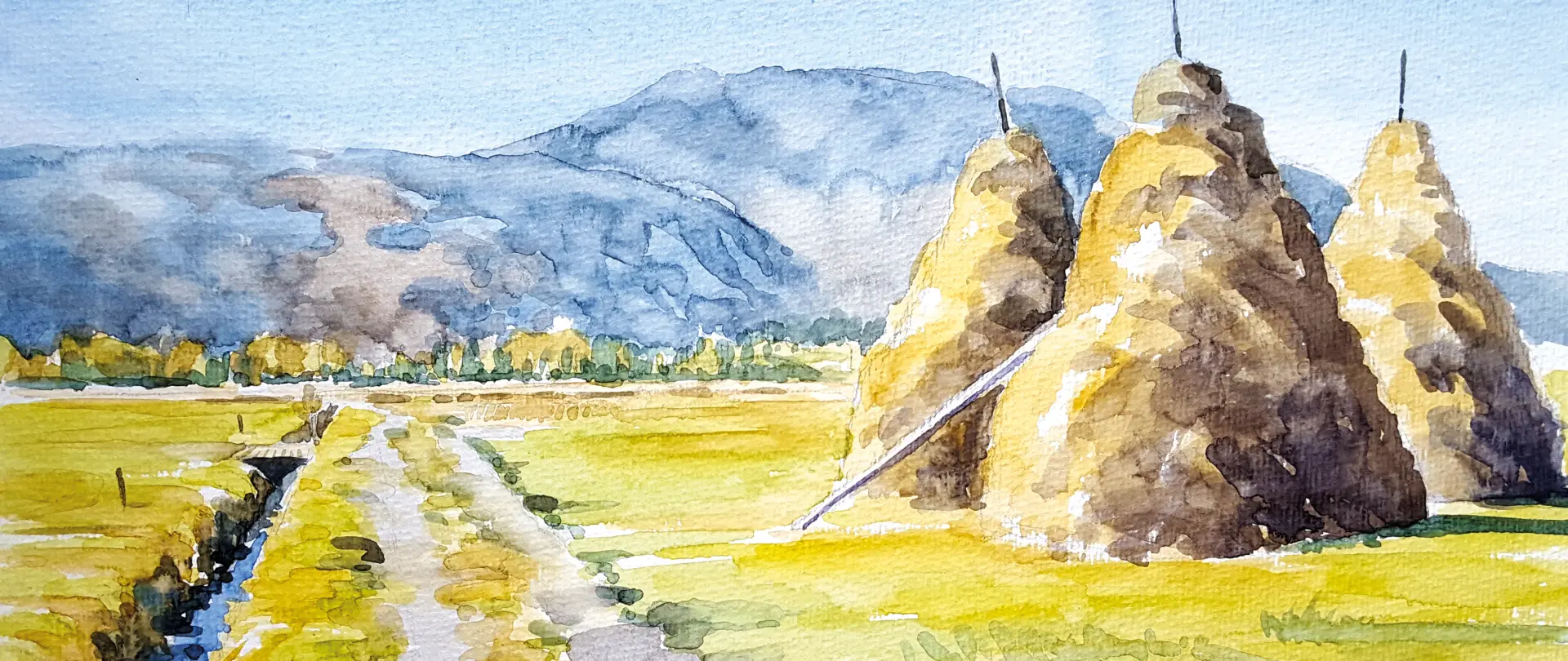 Aquarell-Malerei der Allgäuer Landschaft mit Heuhaufen, Bergen und intensivem Licht- und Farbspiel bei Pleinair-Exkursion