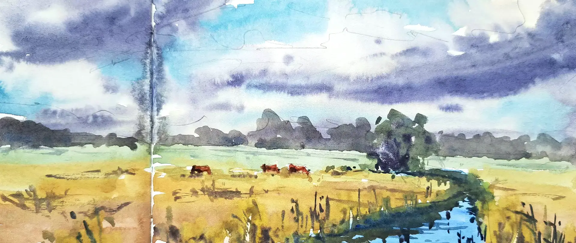 Landschaftsaquarell mit Wiesen, Fluss und Tieren unter dramatischem Himmel als Inspiration für Licht und Stimmung im Skizzenbuch