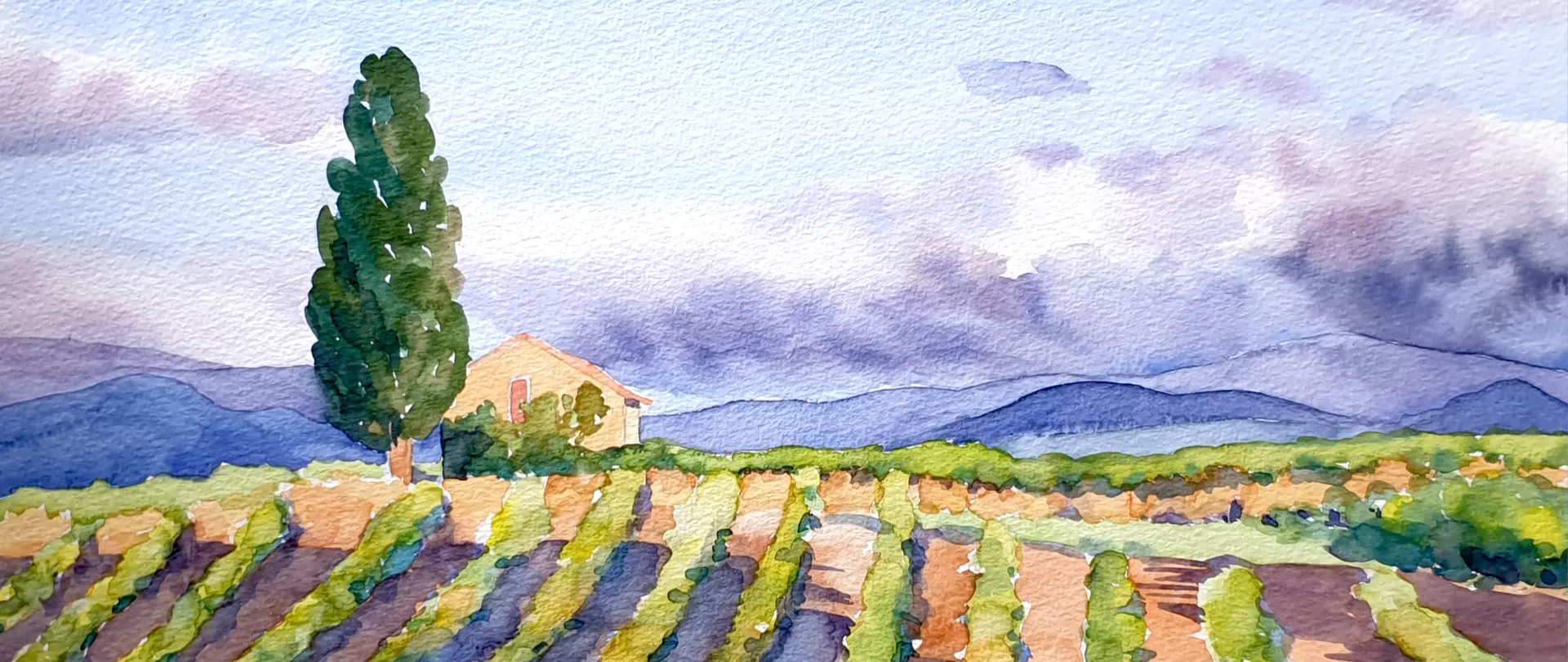 Aquarellbild von einem Acker in einer Berglandschaft, erstellt von Karin Gorgas – Dozentin bei artistravel